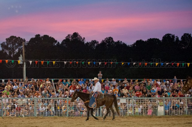 Sunset behind stands at Shady Dale Rodeo.