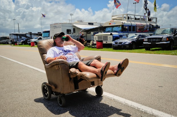 Ken Hochard from Palm Bay, Florida, cruises down the infield in his homemade motorized recliner prior at Daytona International Speedway prior to the start of the NASCAR Sprint Cup Series Coke Zero 400.